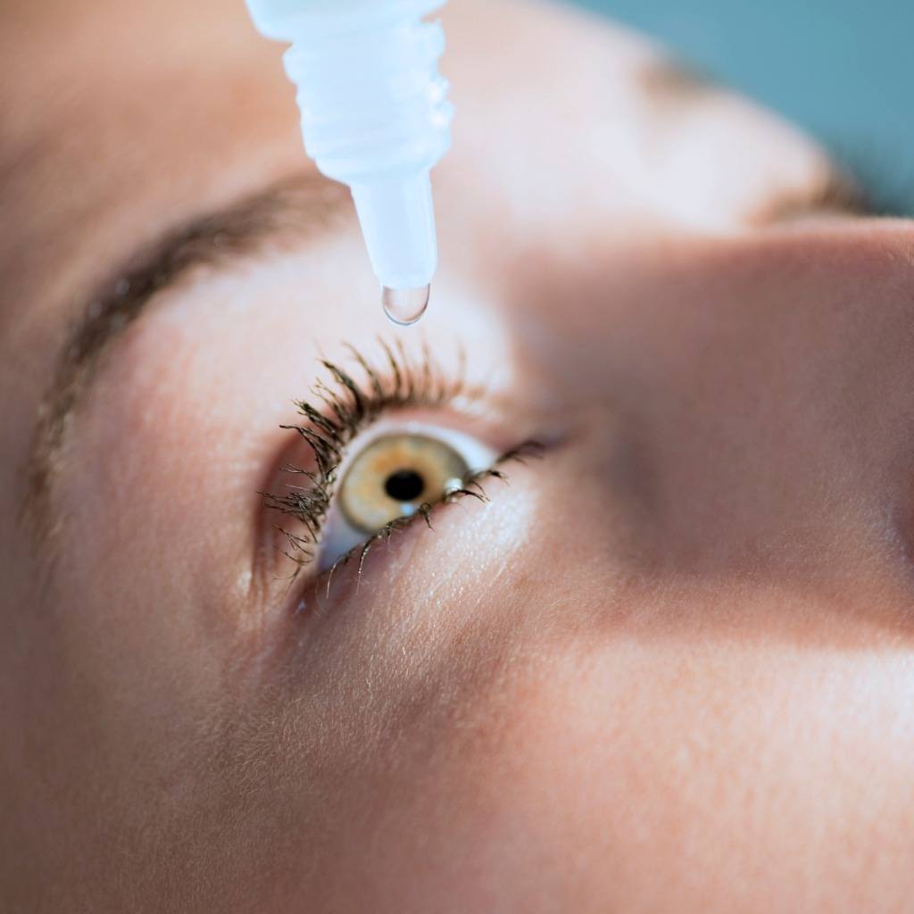 Eyedrop falling into an eye