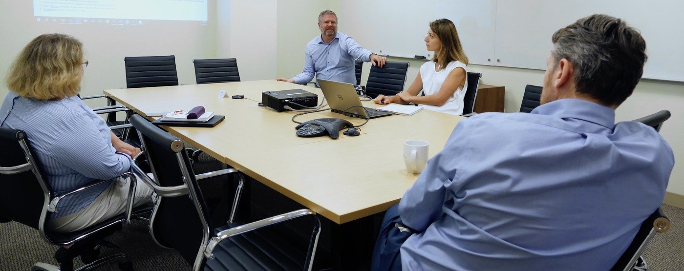 Team of four people in a meeting